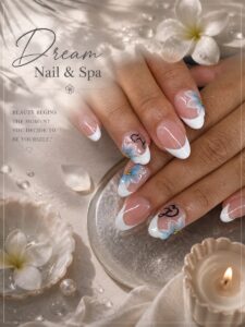 White French tip nails with blue 3D florals at Dream Nails & Spa, Vacaville CA